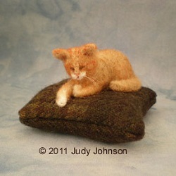 Needle felted pincusion with sleeping kitty by Judy Johnson