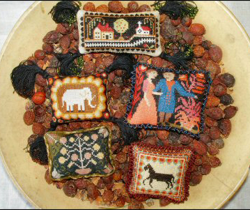Carriage House Samplings Folk Art pincushions